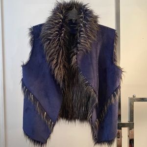 Blue fur vest.